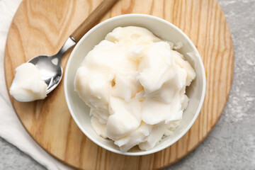 Bowl of lard spread on grey background