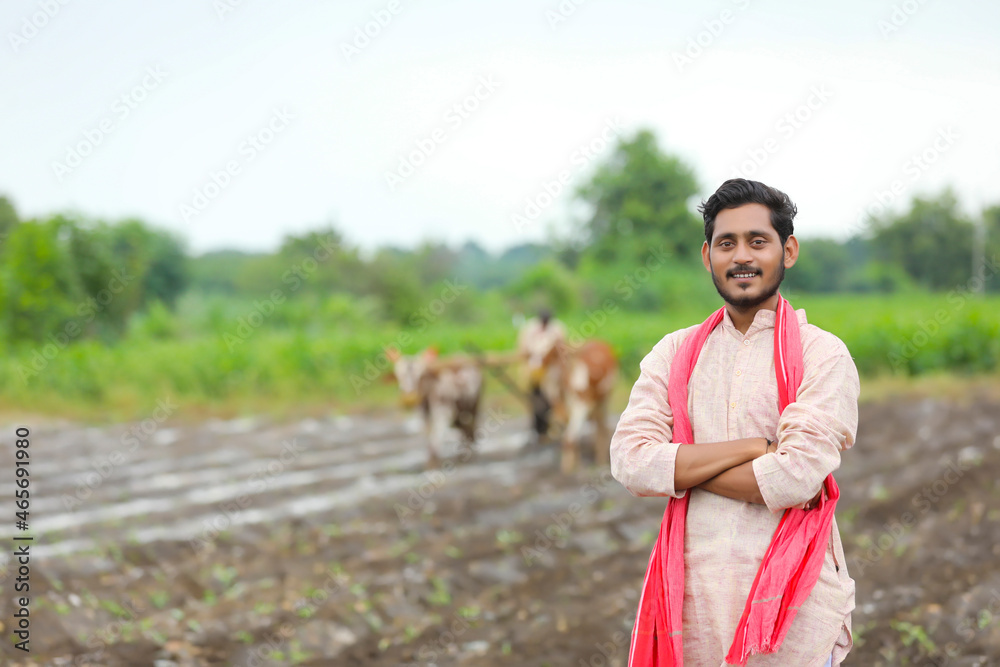 Sticker indian farmer standing at agriculture field.