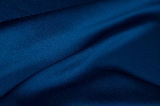 Fabric satin silk drapery. Blue textile