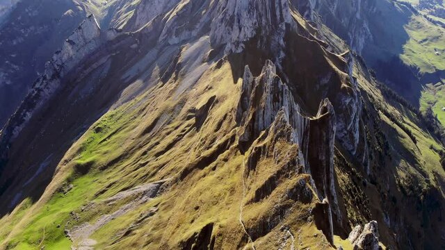 Aerial flyover over Schaefler ridge in Appenzell, Switzerland towards Altenalpt&uuml;rm