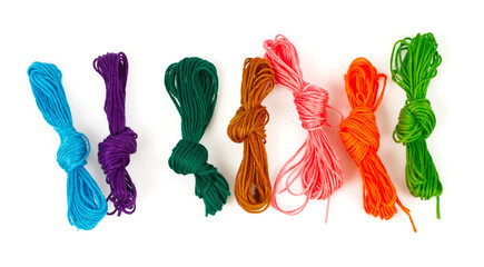 A set of multicolored threads for embroidery isolated on white background
