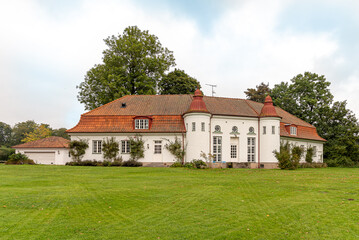 Fototapeta na wymiar a big villa in the green park of Hjularod Castle