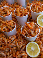 red boiled shrimp on the counter of the store. sea shrimp ready to eat. street food