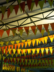 holiday flags stretched in the tent. multicolored flags