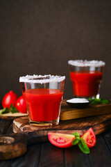 Closeup view of glass with salty tomato juice