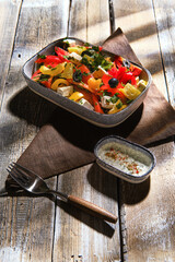 Salad with fresh tomato, bell pepper, cilantro, feta and marinated black olives