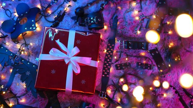 christmas gift among accessories for sex bdsm games in neon light