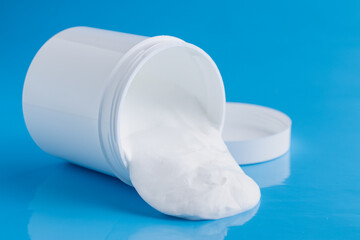 Protective sunscreen or sunblock cream and sunbath sun care lotion in white plastic bottles