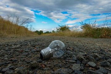 light bulb on a gravel road