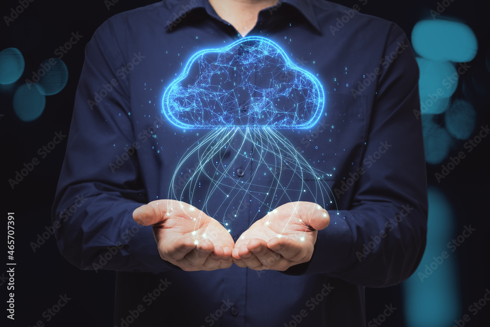 Fototapete Close up of male hands holding glowing blue digital cloud with binary code on dark blurry bokeh background. Computing and coding concept.