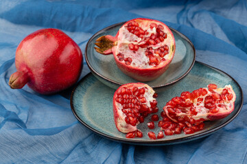 Beautiful red pomegranate fruit composition on a plate background. Azerbaijan