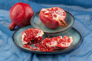 Beautiful red pomegranate fruit composition on a plate background. Azerbaijan