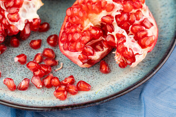 Composition with ripe pomegranates on blue table