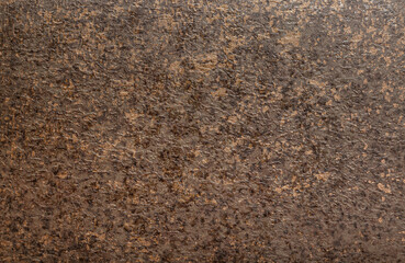 Background stone wall with abstract spots. Beautiful brown, bronze texture with stains, abstract surface background, modern bright painting of walls in trending shades, unusual spotty surface.