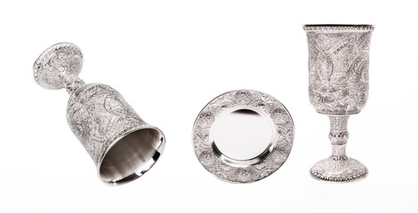 Silver kiddush wine cup and saucer isolated on white background.