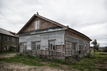 Fototapeta na wymiar Old wooden houses , Arctic, Barents Sea, the village of Teriberka