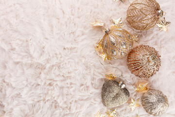 Golden christmas balls with wool background.