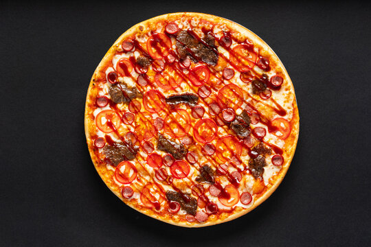 tasty pizza on the black background