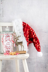 Obraz premium Christmas Decoration, Santa Claus Hat And Wooden Chair.