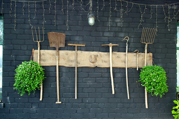Vintage peasant hand tools on the wall.