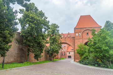 Part of Castle of the Teutonic Knights at cloudy day in Torun, Poland.