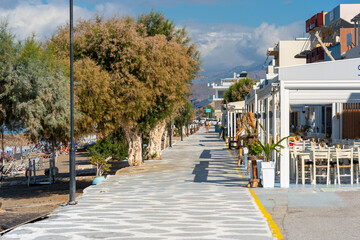 Boardwalk with restaurants, shops and coffee houses at the waterside of the tourist resort Kalamaki...