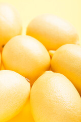 Several yellow bright lemons. Bright citruses.