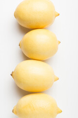 Several yellow bright lemons on a white background. Bright citruses.