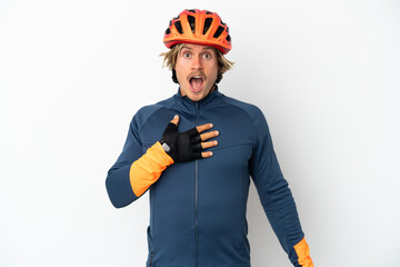 Young blonde cyclist man isolated on white background surprised and shocked while looking right - obrazy, fototapety, plakaty