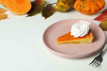 Concept of tasty food with pumpkin pie on white background