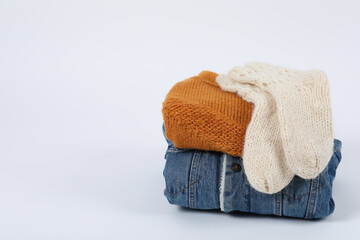 Winter clothes on white background, close up