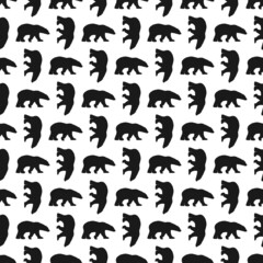 seamless winter pattern with black polar bears silhouettes.