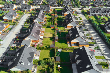 Modern residential district in Europe town, aerial view. Residential neigborhood, bird eye view. City streets with luxury house buildings and parked car