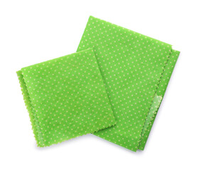 Fototapeta premium Green reusable beeswax food wraps on white background, top view