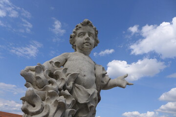 Fototapeta na wymiar Stone statue of Cupid in the park, Bratislava, Slovakia