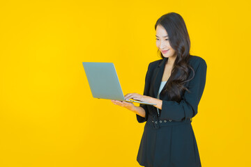 Portrait beautiful young asian woman smile with computer laptop