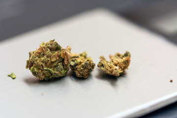 Close up shot of cannabis or marihuana on a gram scale 