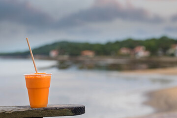 glass of fruit juice on the edge of the terrace