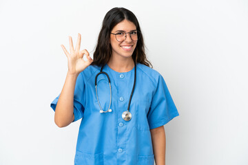 Young surgeon doctor caucasian woman isolated on white background showing ok sign with fingers