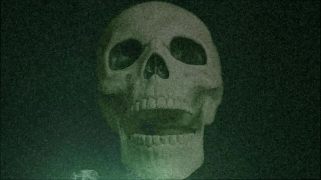 Chattering skull stop motion animation with smoke in foreground