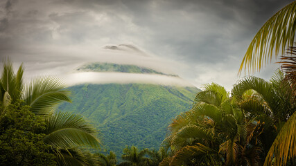 The Arenal Volcano under a dramatic sky. Rare ring clouds. La Fortuna, Costa Rica. 