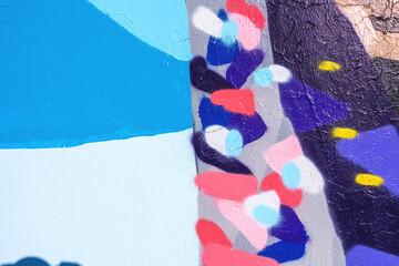 Closeup of colorful blue, pink and yellow urban wall texture. Modern pattern for wallpaper design. Creative modern urban city background for advertising mockups. Minimal geometric style, solid colors