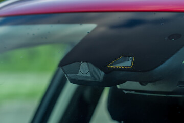Windshield rain and light sensors of modern car. Car rain sensor.