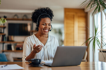 Adult african-american woman, having a warm drink