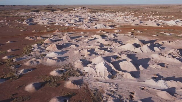 an aerial pan of opal mine mullock heaps at coober pedy in outback south australia