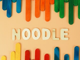 Terengganu, Malaysia-October 27,2021 :Wooden Noodle Word With Blue Background