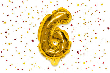 The number of the balloon made of golden foil, the number six on a white background with multicolored sequins. Birthday greeting card with inscription 6. Numerical digit, Celebration event, template.