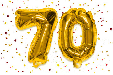 The number of the balloon made of golden foil, the number seventy on a white background with...