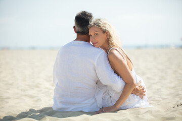Fototapeta na wymiar mid aged couple on the beach