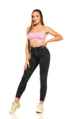 Full length front view of young woman in black jeans